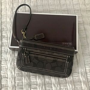 Dark brown Coach large wristlet with two pockets